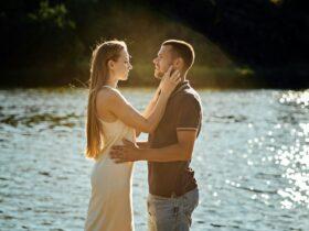 Declarations of Love, Candid couple in love holding hands on nature background.