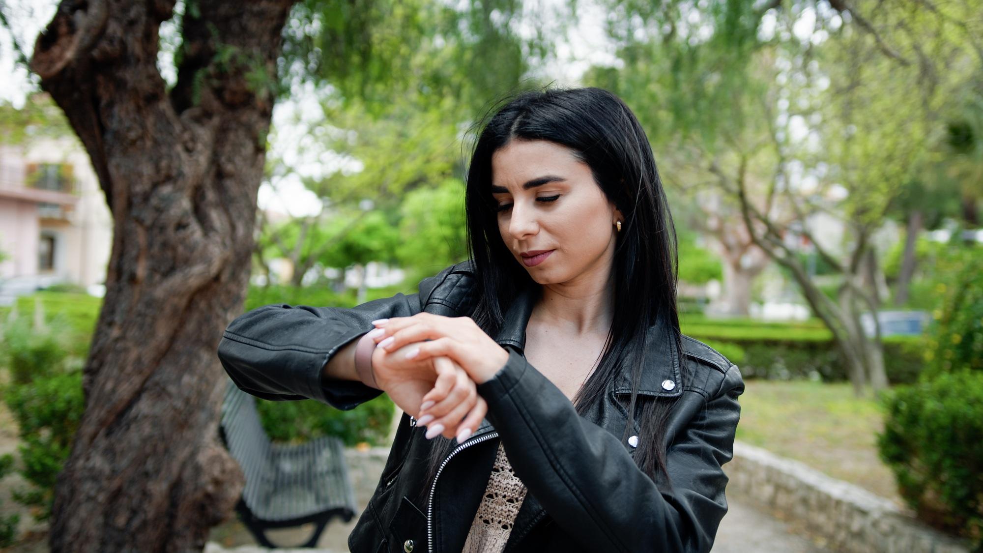 Woman Checking Time With The Watch